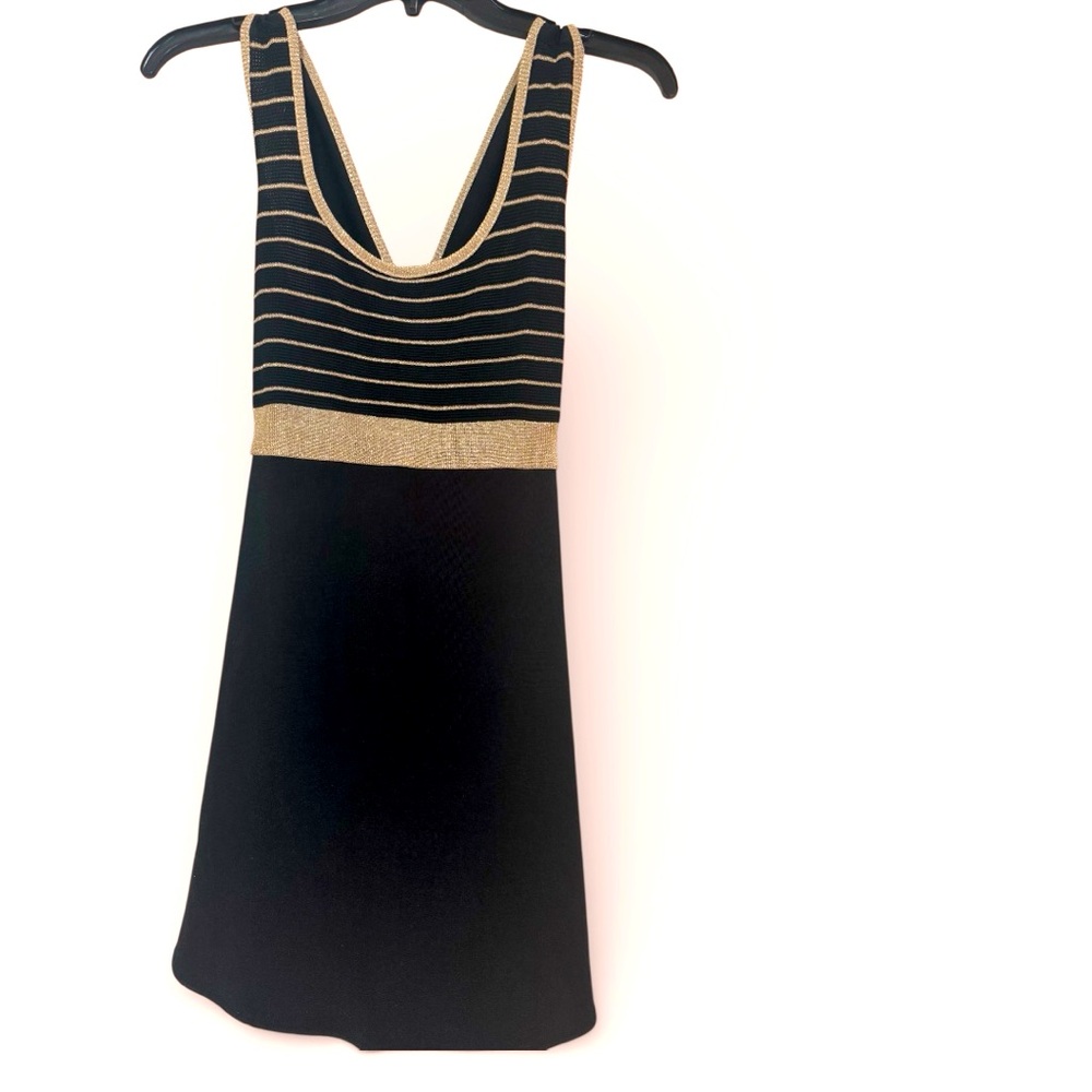 Black and gold, short dress. Size 7/8 in good used condition.